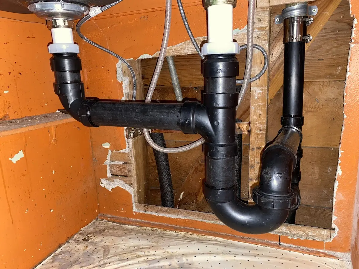 Professional Garbage Disposal Repair equipment and tools on the job in Two Harbors